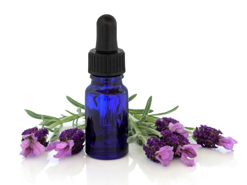 Sarah Butler Therapies - photo of blue dropper bottle surrounded by lavender flowers